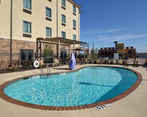 Seasonal outdoor pool, open 9:00 AM to 10:00 PM, pool umbrellas
