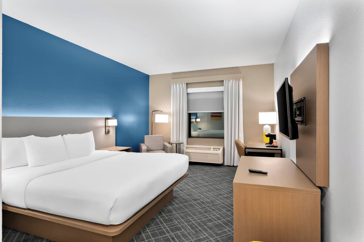 Desk, laptop workspace, blackout curtains, iron/ironing board