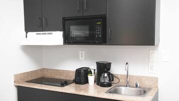 Fridge, microwave, stovetop, coffee/tea maker