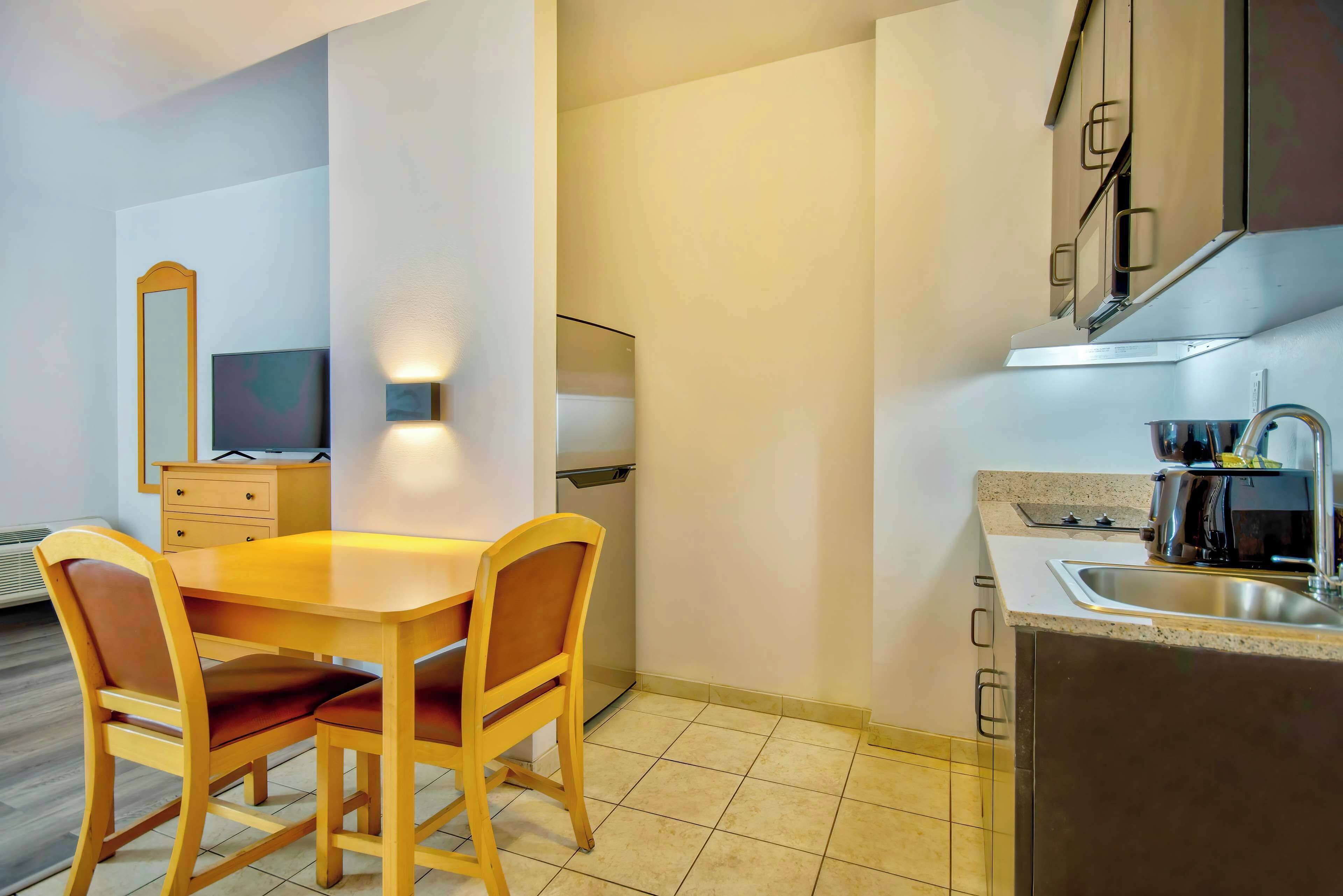 Fridge, microwave, stovetop, coffee/tea maker