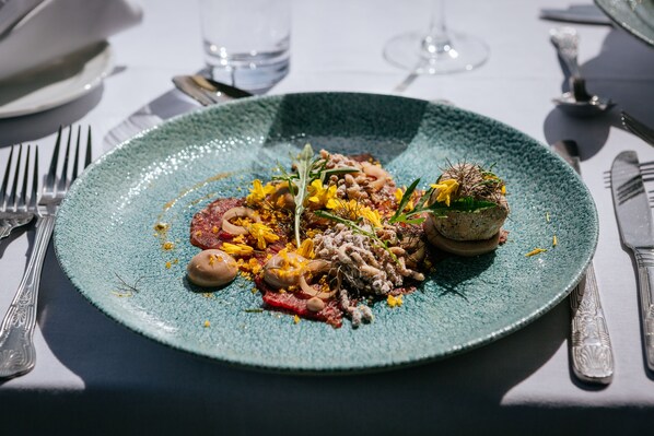 A plate of food with various ingredients and garnishes. - Eccles Hotel Glengarriff (Glengarriff)