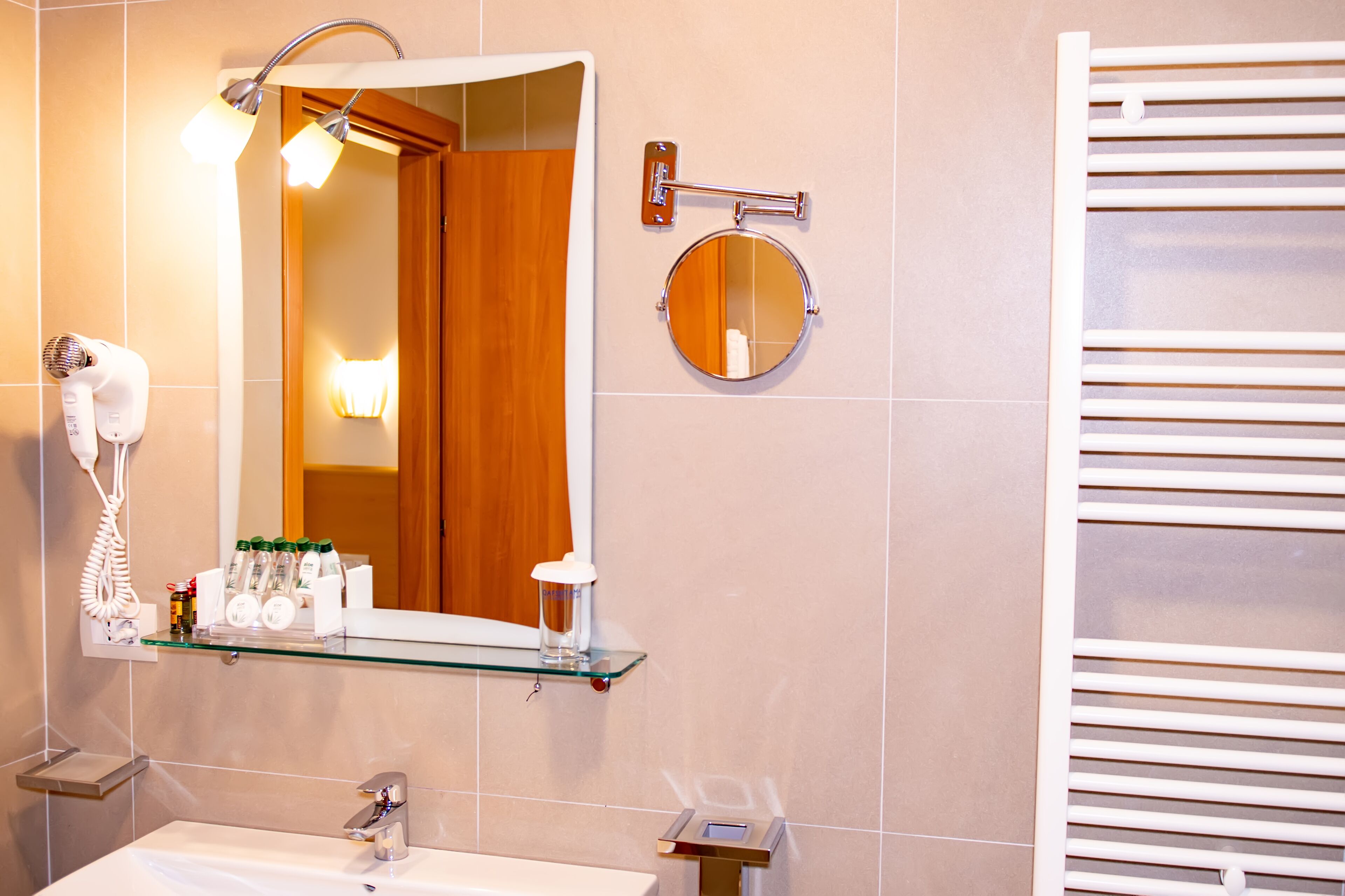 standard double room | bathroom | shower, hydromassage showerhead, designer toiletries, hair dryer