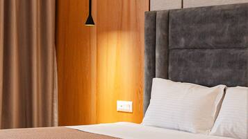 Frette Italian sheets, premium bedding, down duvets, free minibar items