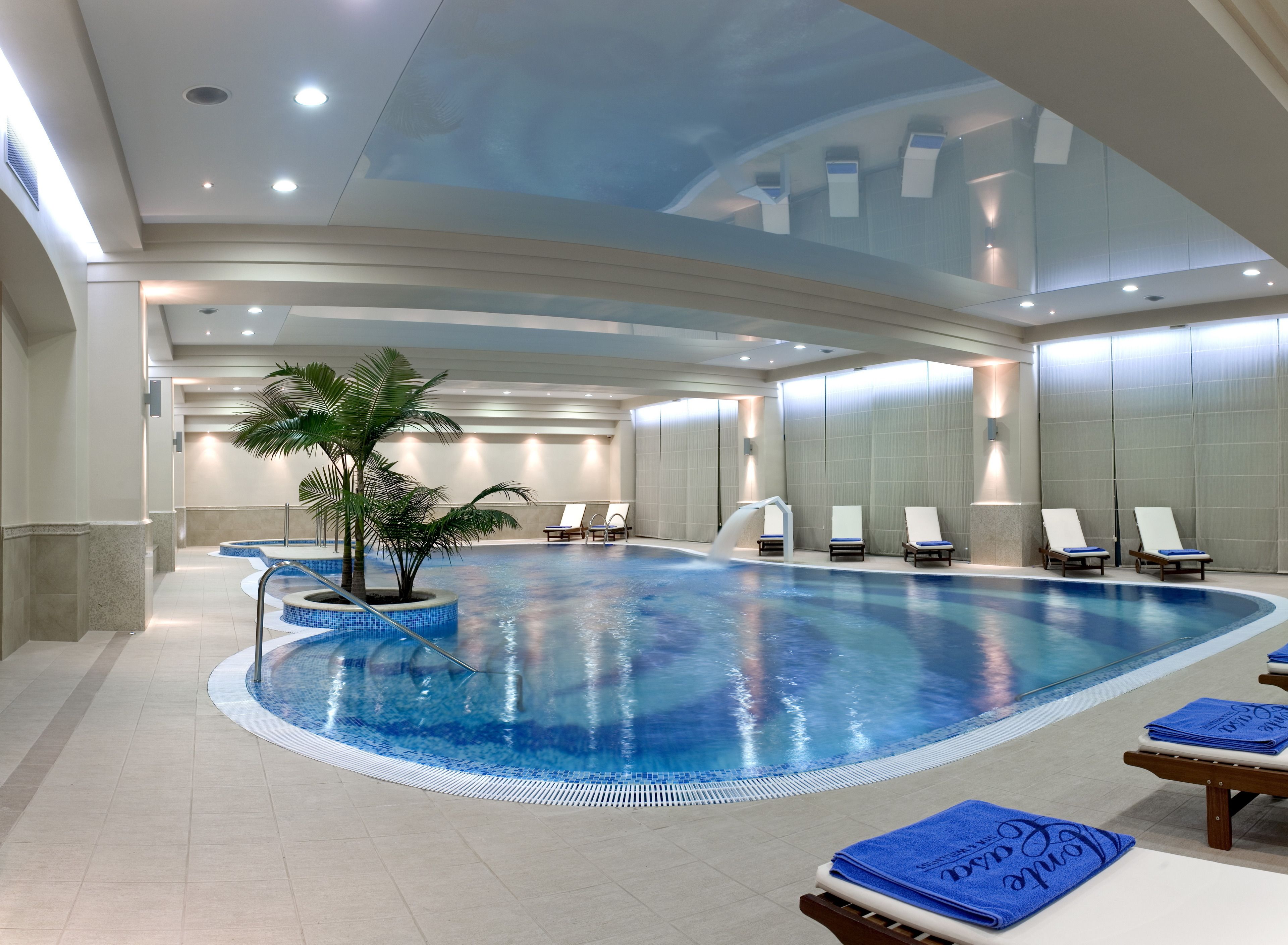 indoor pool, outdoor pool, pool umbrellas, pool loungers
