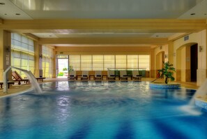 Indoor pool, outdoor pool, pool umbrellas, pool loungers