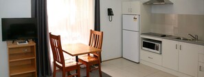 One Bedroom Apartment | Blackout drapes, iron/ironing board, bed sheets