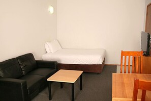 One Bedroom Apartment | Living area | 32-inch LCD TV with digital channels, TV