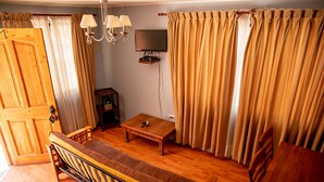 Classic Apartment | Living area | 26-inch LCD TV with cable channels, TV - Ayelen Apart Hotel (Calama)