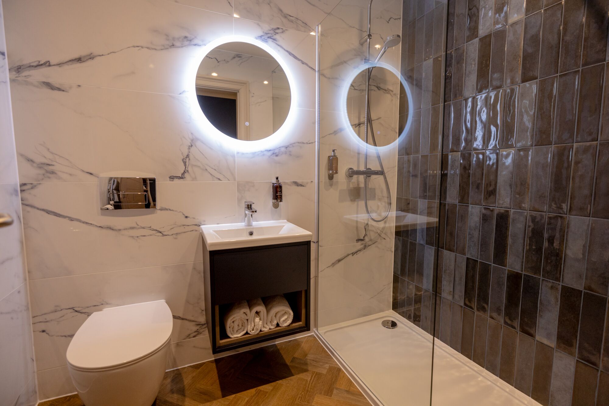 deluxe double room (front facing) | bathroom | shower, hair dryer, towels