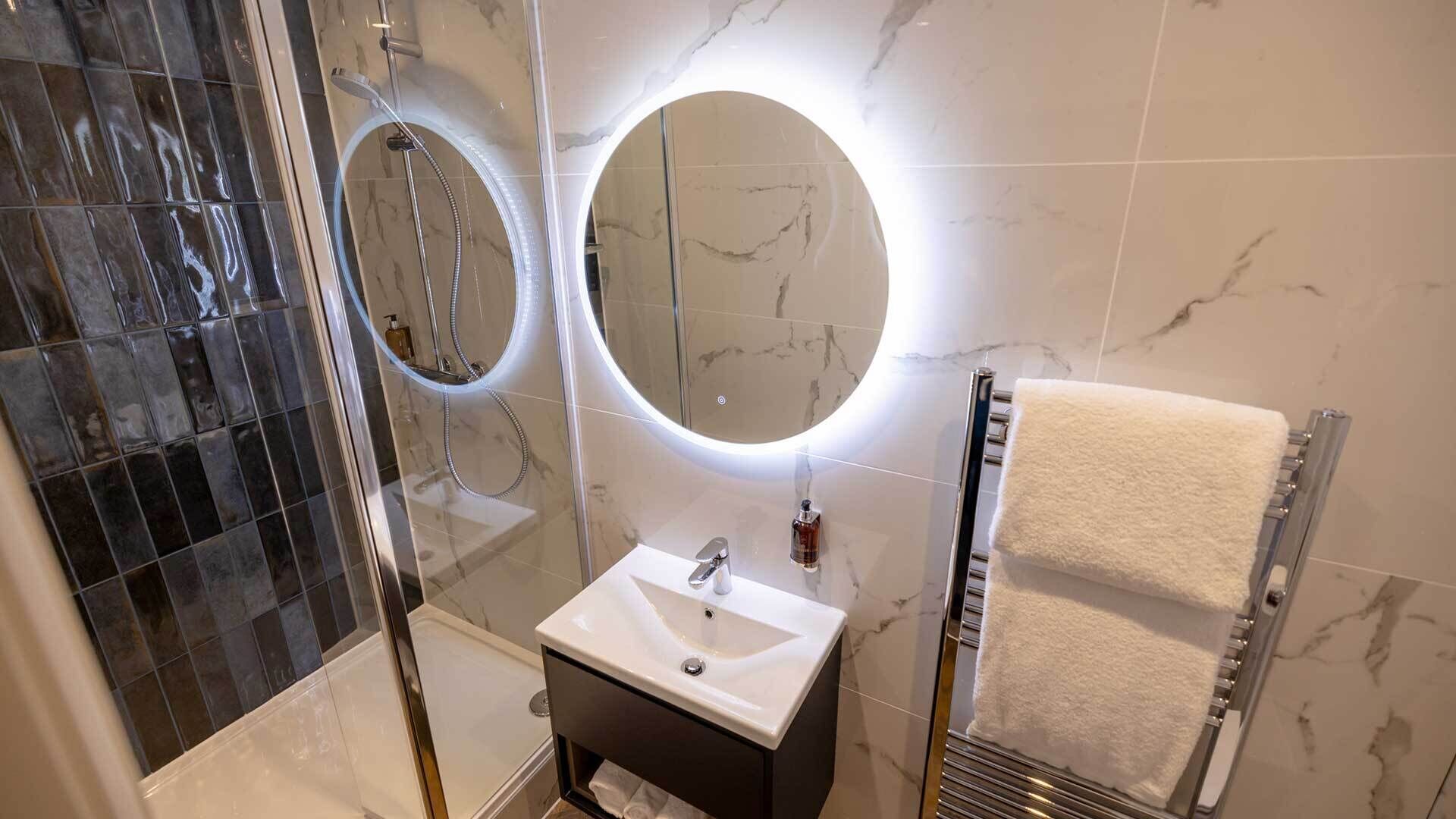 classic double room (limited view) | bathroom | shower, hair dryer, towels