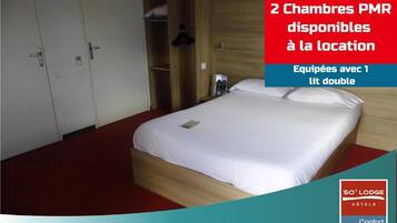 A hotel room with a bed, wardrobe, and a note about payment policy.