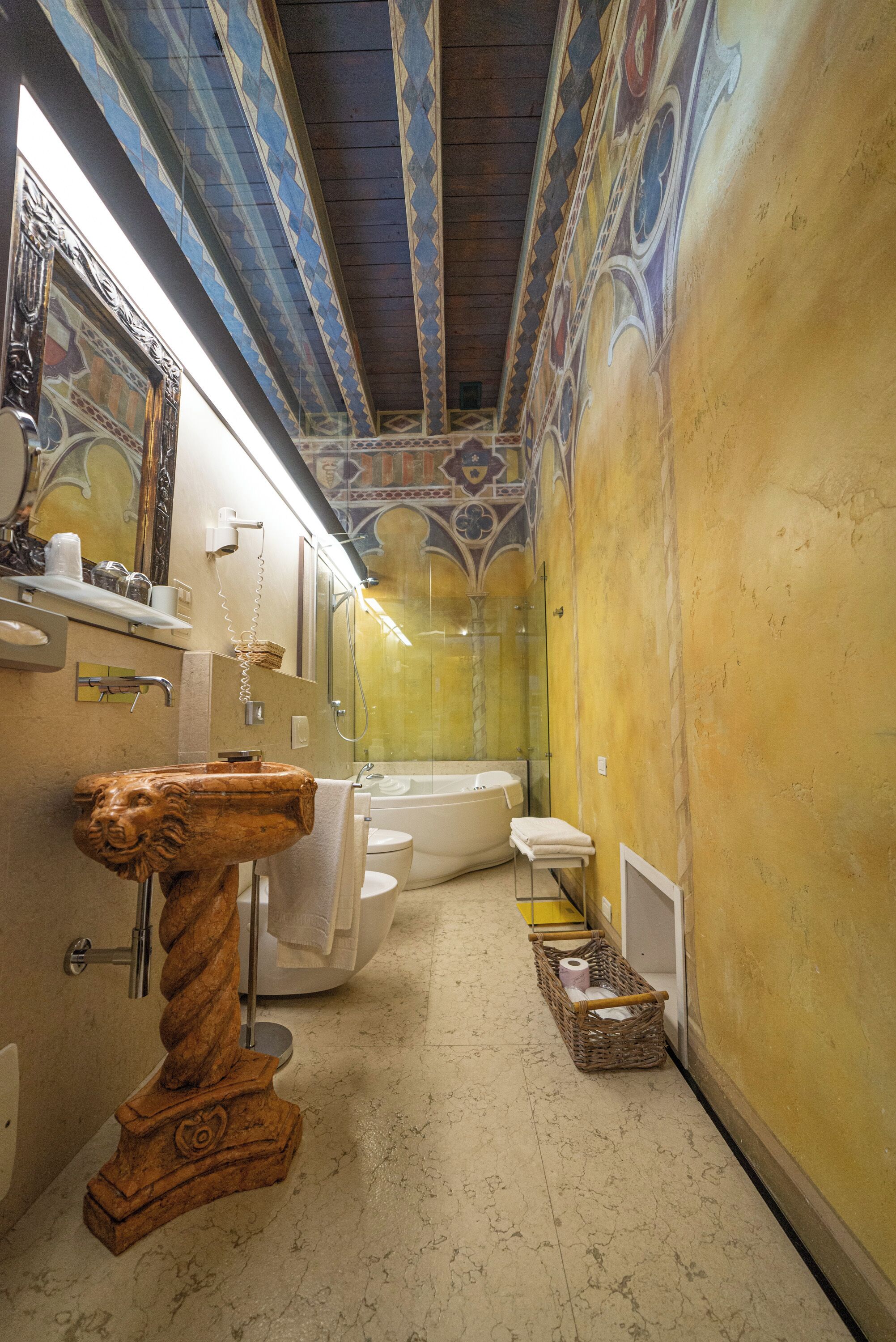 royal suite | bathroom | deep-soaking bathtub, rainfall showerhead, free toiletries, hair dryer