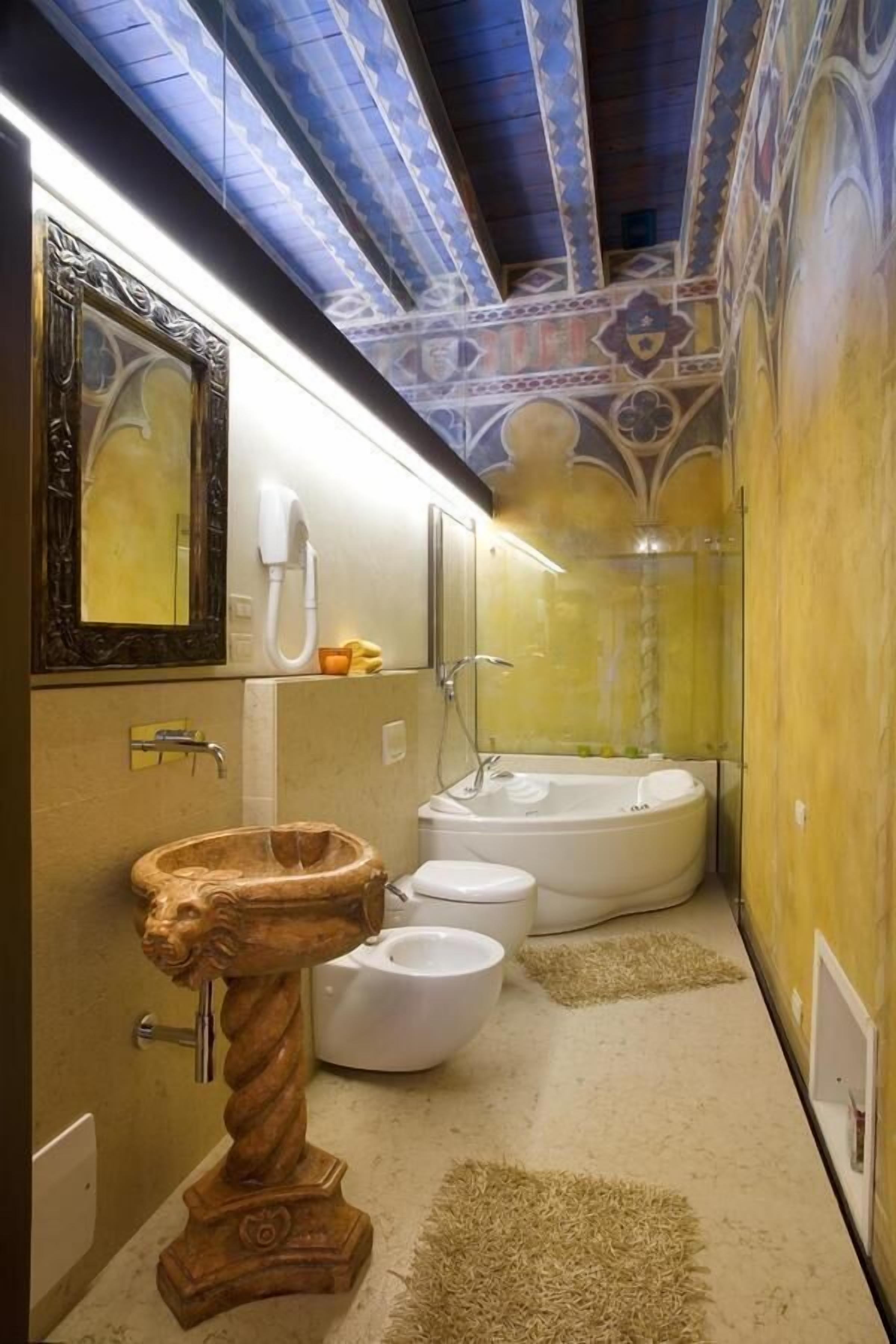 royal suite | bathroom | deep-soaking bathtub, rainfall showerhead, free toiletries, hair dryer