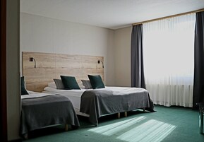 Comfort Quadruple Room | Desk, laptop workspace, blackout drapes, free WiFi