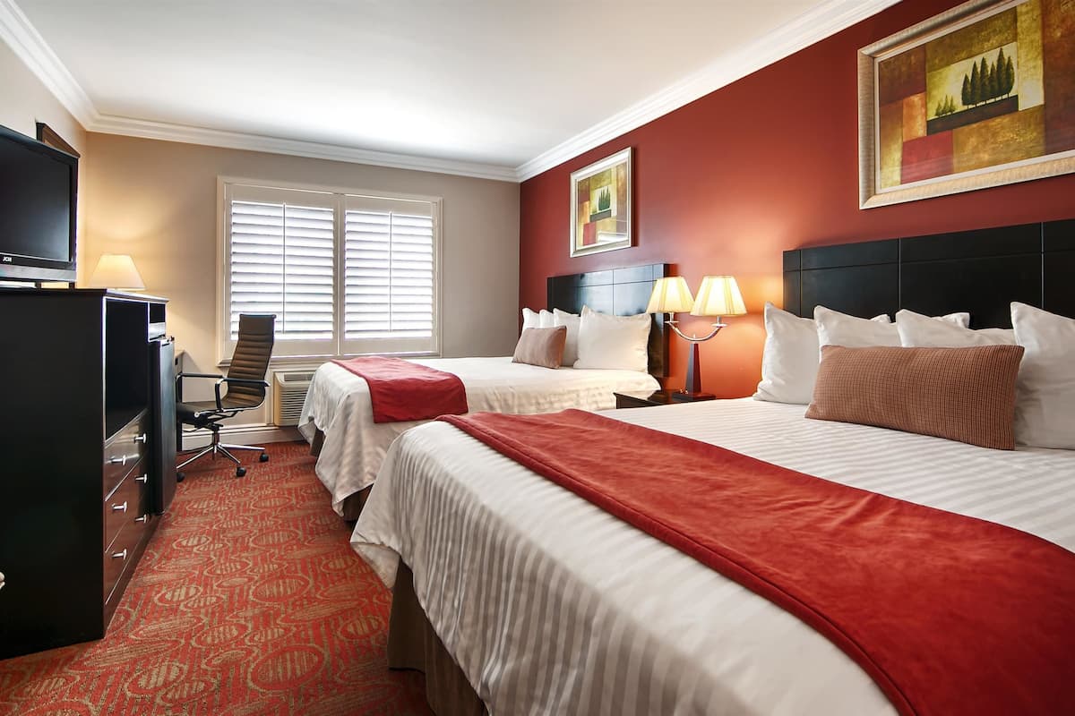 standard room, 2 queen beds, non smoking, refrigerator & microwave | in-room safe, desk, iron/ironing board, wifi