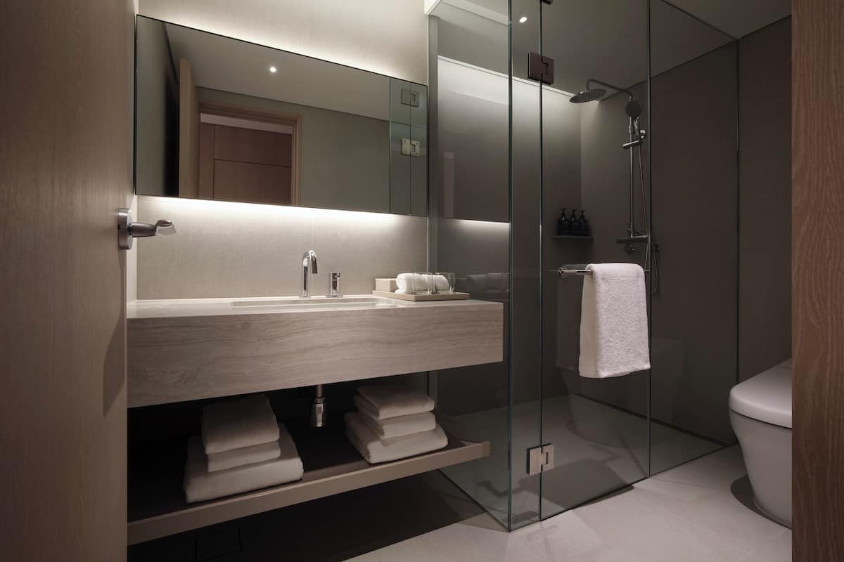 designer toiletries, hair dryer, dressing gowns, slippers