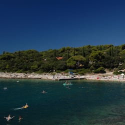 On the beach, waterskiing