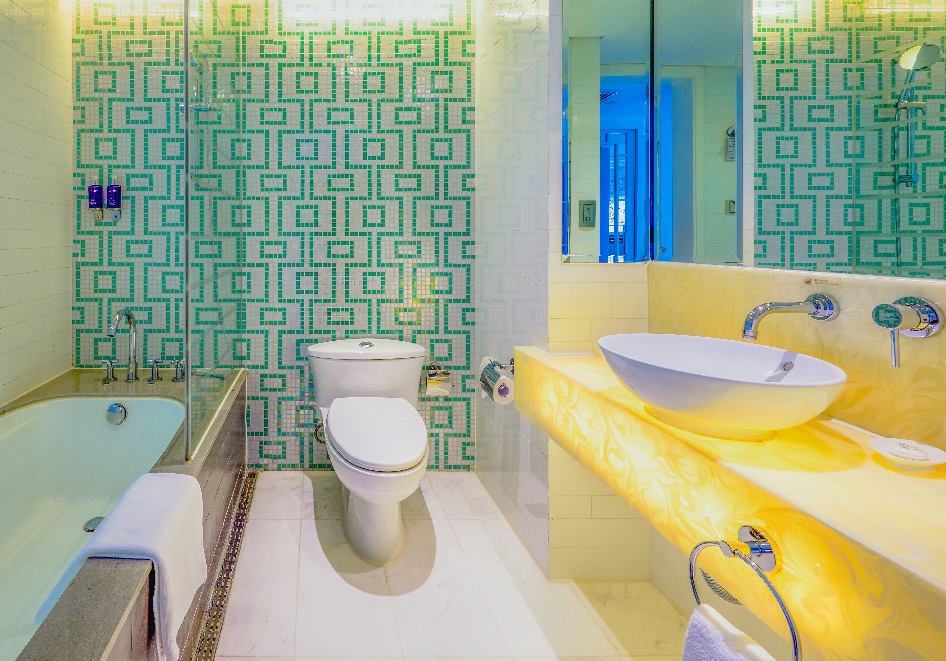 deep-soaking bathtub, rainfall showerhead, free toiletries, hair dryer