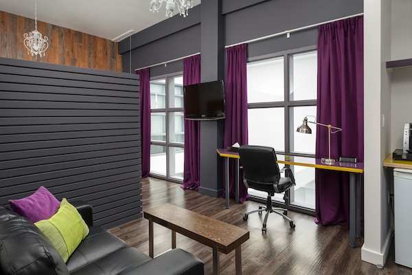 Marvelous Room, Studio Suite, Queen Bed, Courtyard View | Living area | 50-inch Smart TV with cable channels, iPod dock