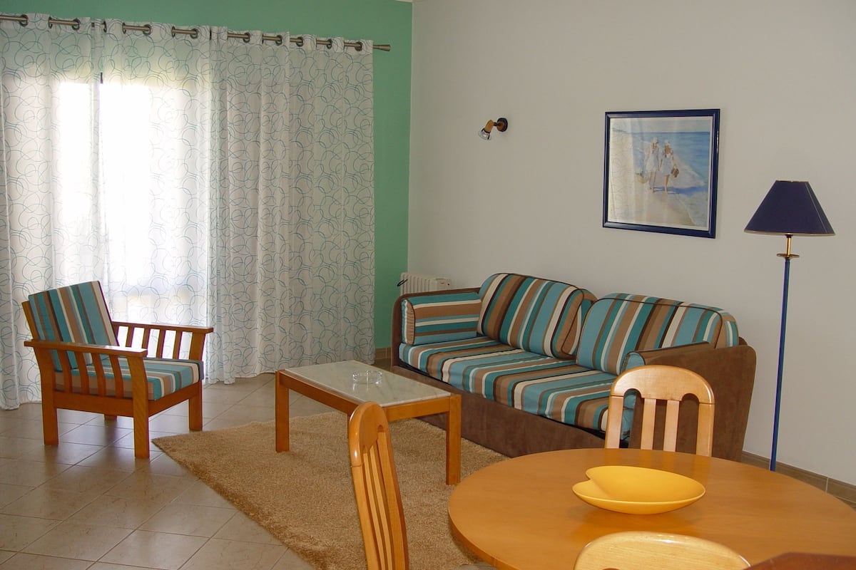 Apartment, 1 Bedroom | Living area | 25-cm plasma TV with cable channels, TV