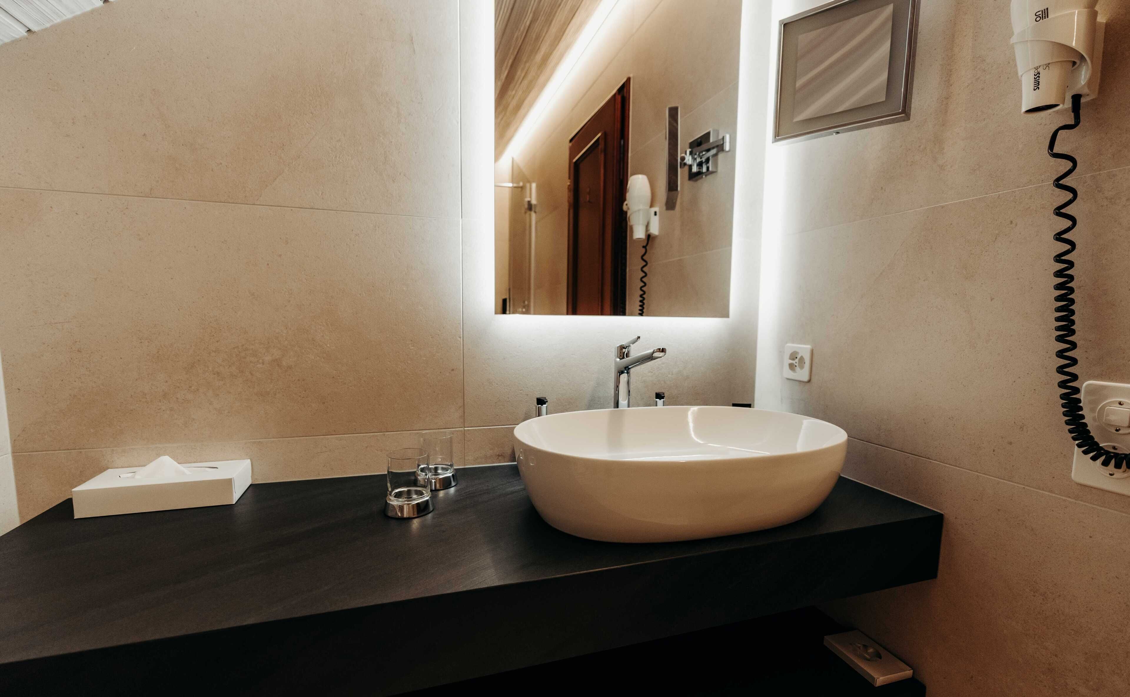 superior double room | bathroom | hair dryer, dressing gowns, slippers, towels