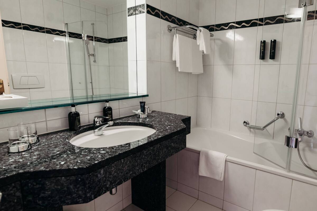 standard double room | bathroom | hair dryer, dressing gowns, slippers, towels