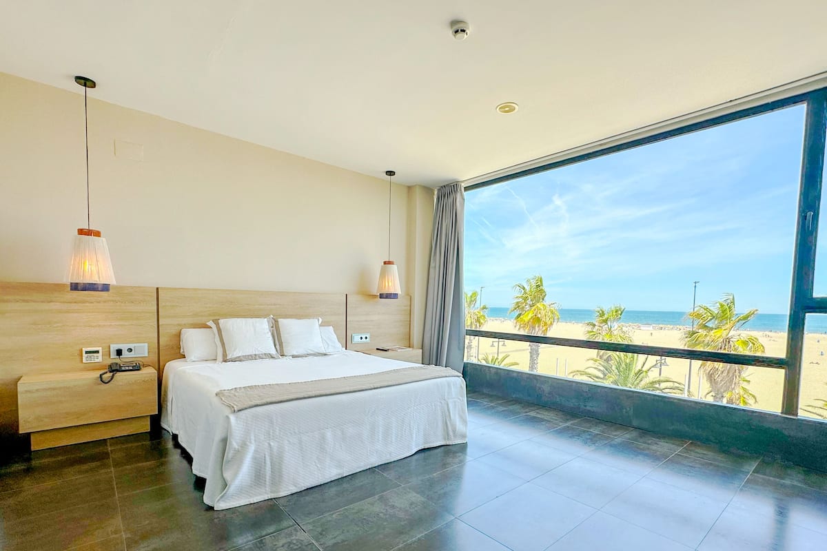Suite, Sea View | Minibar, in-room safe, blackout drapes, iron/ironing board