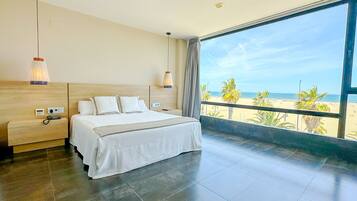 Suite, Sea View | Minibar, in-room safe, blackout curtains, iron/ironing board