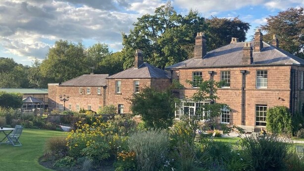 A large brick house with a well-maintained garden and a lawn. - Oakhill  (Matlock)
