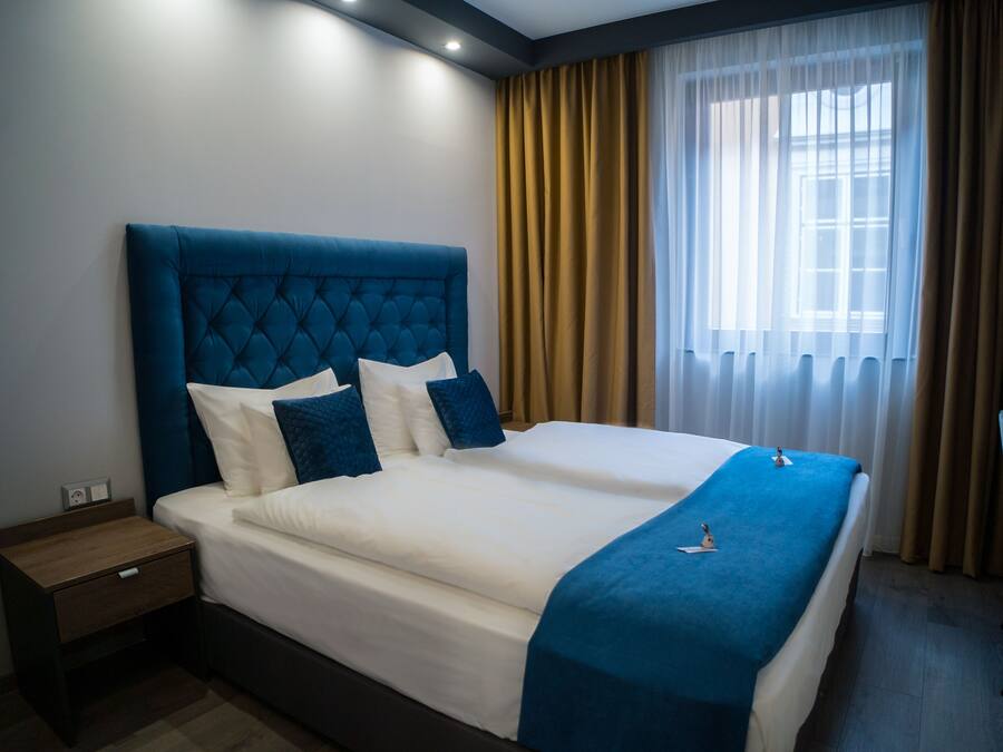 Standard Quadruple Room | In-room safe, desk, free WiFi, bed sheets
