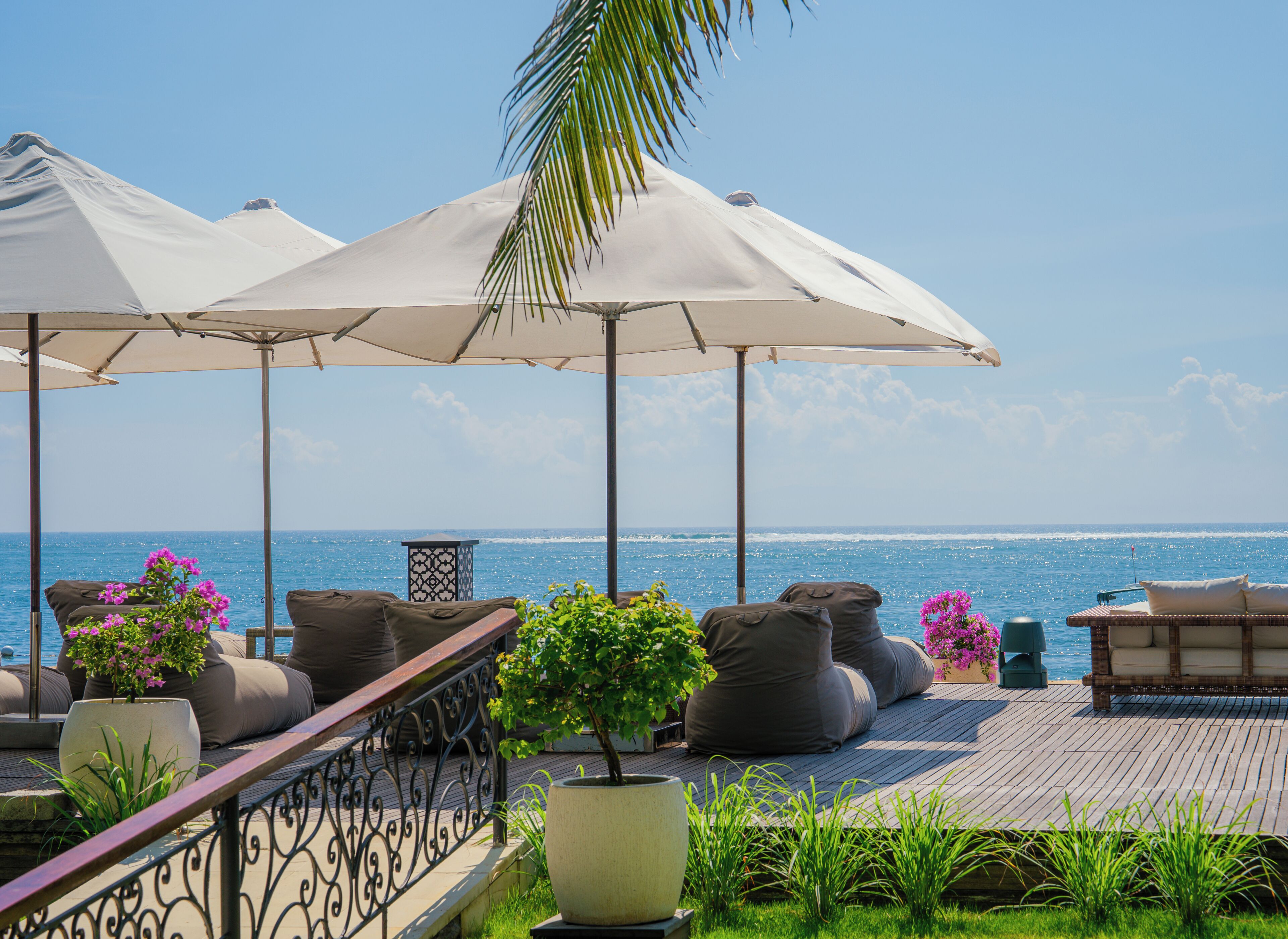 On the beach, white sand, sun loungers, beach umbrellas