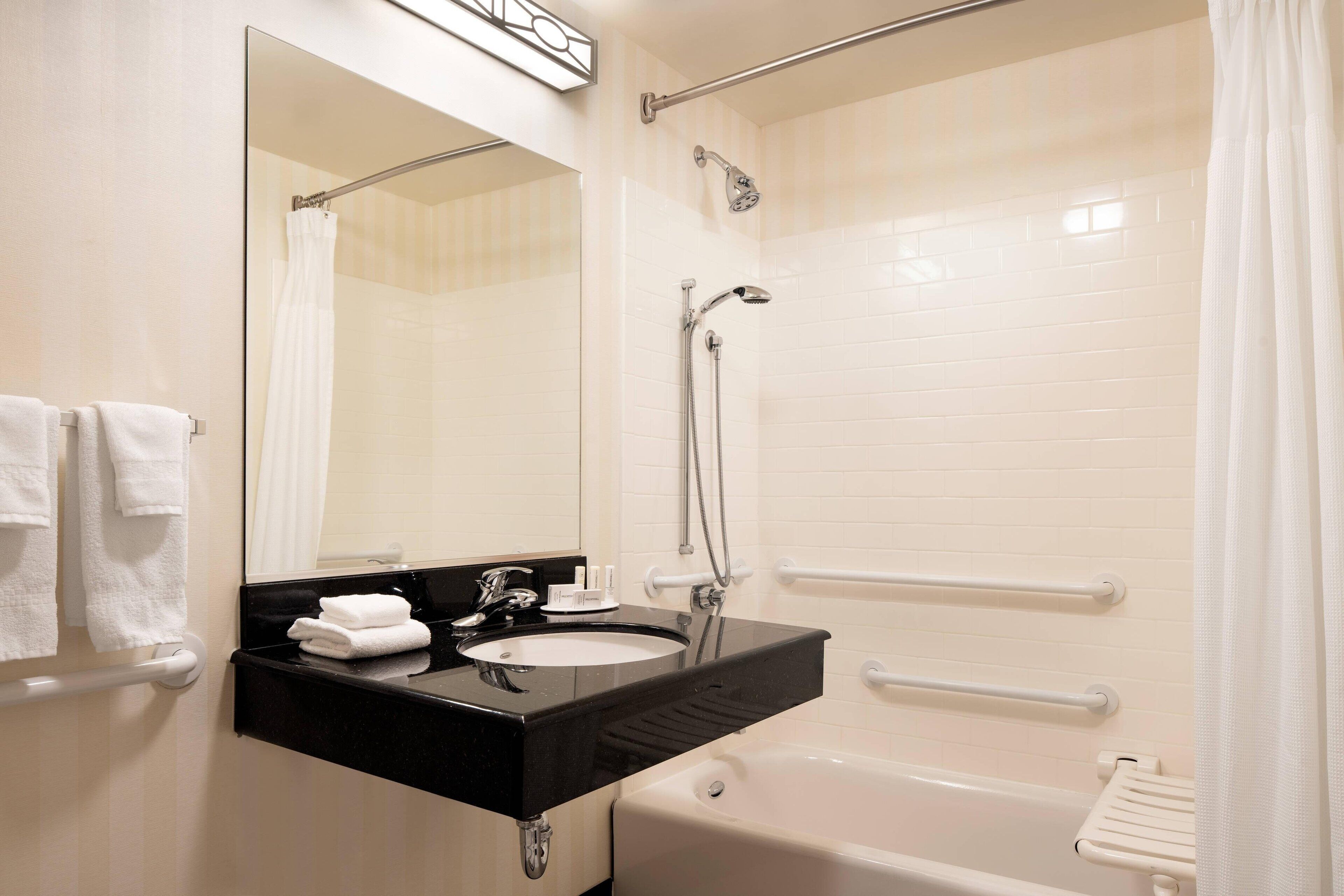 combined shower/bathtub, free toiletries, hair dryer, towels