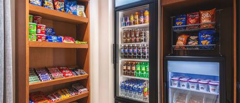 A snack and beverage vending machine with various snacks and drinks.