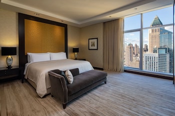 A gym with treadmills, a stationary bike, and a kettlebell. at InterContinental New York Times Square by IHG