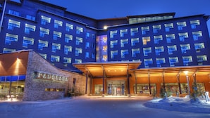 A multi-story hotel with a prominent entrance, large windows, and a brick facade. - Hotel Levi Panorama (Kittila)