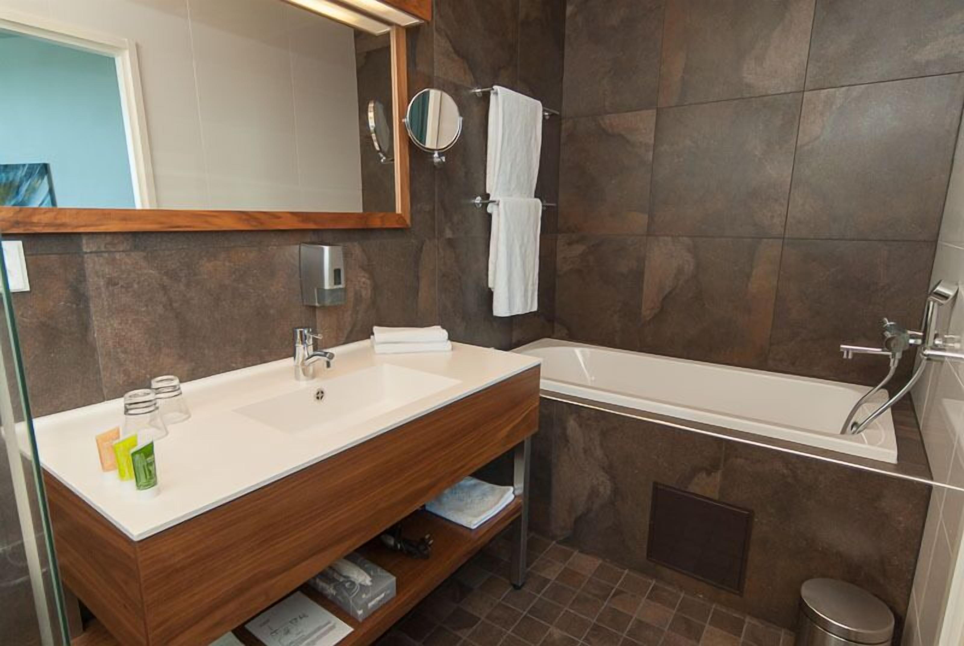 sky suite deluxe | bathroom | shower, hair dryer, towels, soap