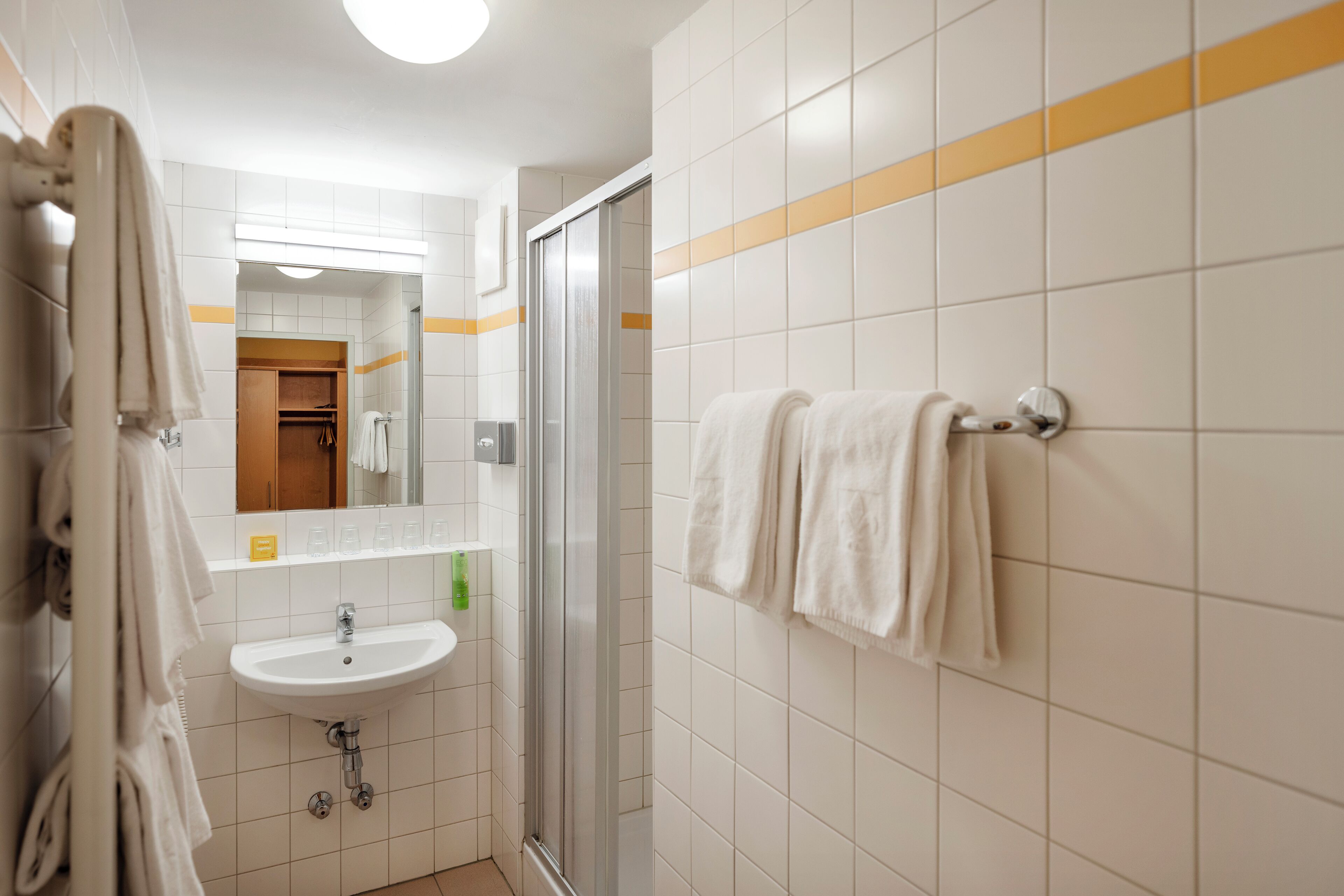 duplex | bathroom | shower, hair dryer, towels