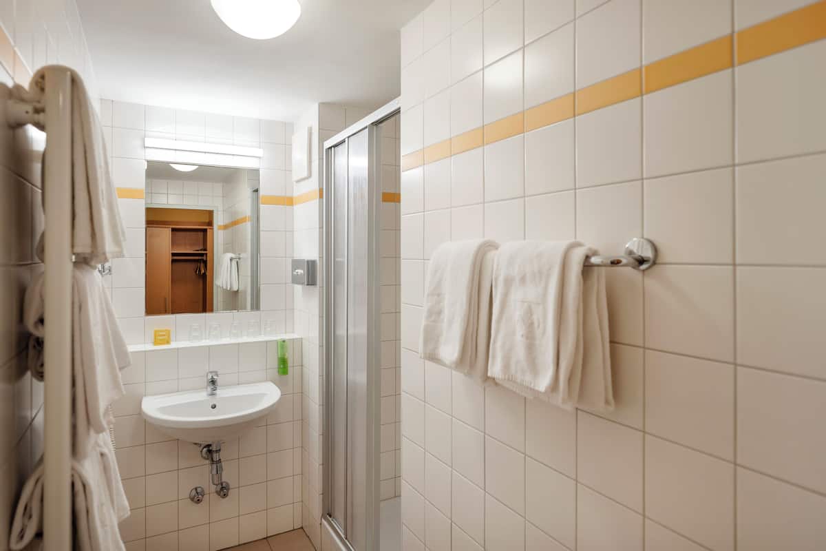 duplex | bathroom | shower, hair dryer, towels