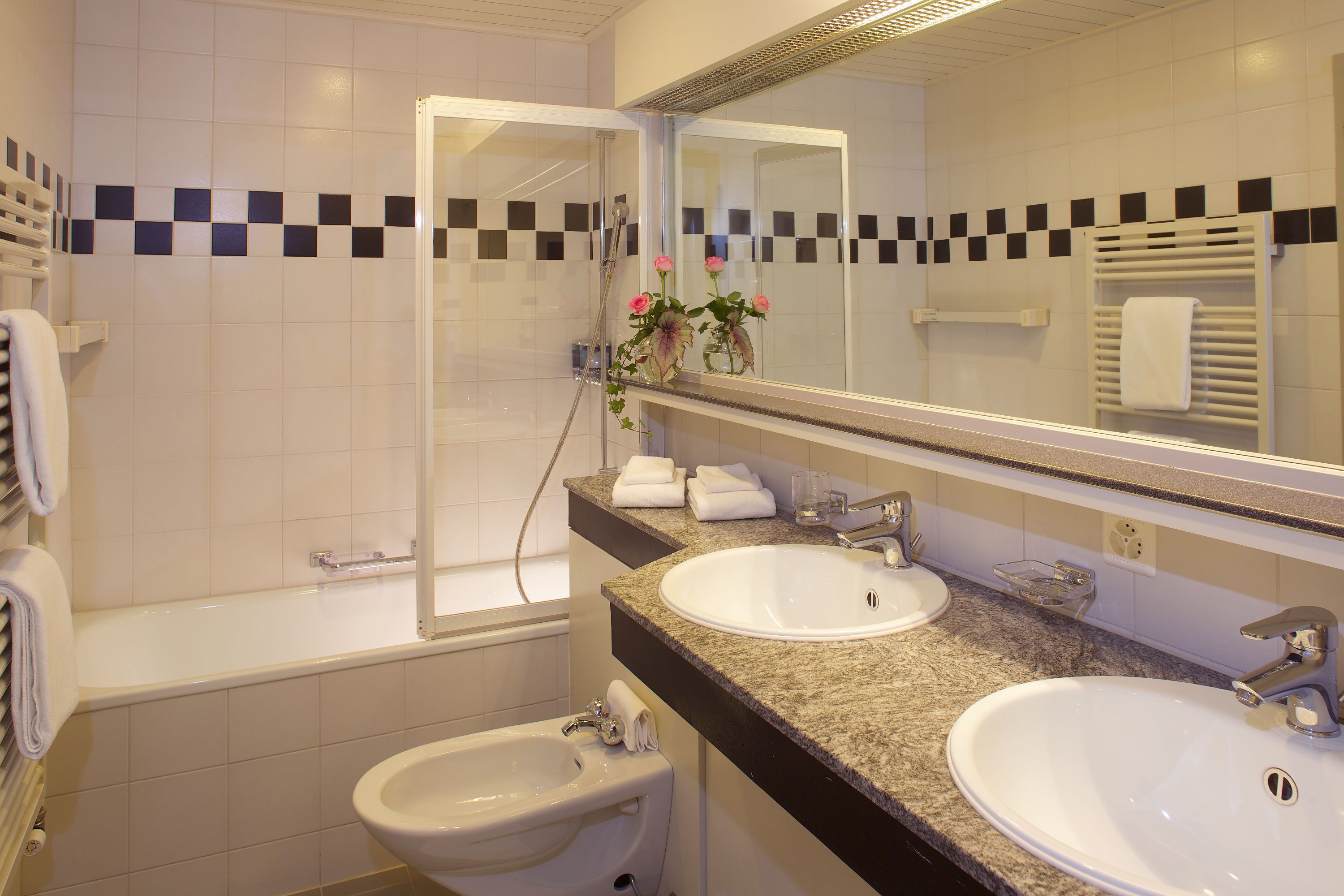 eco-friendly toiletries, hair dryer, bathrobes, slippers