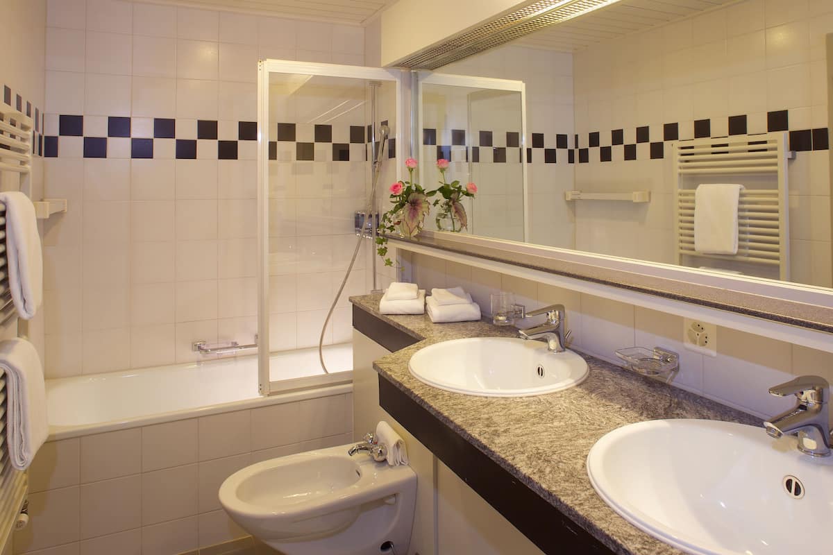 eco-friendly toiletries, hair dryer, bathrobes, slippers