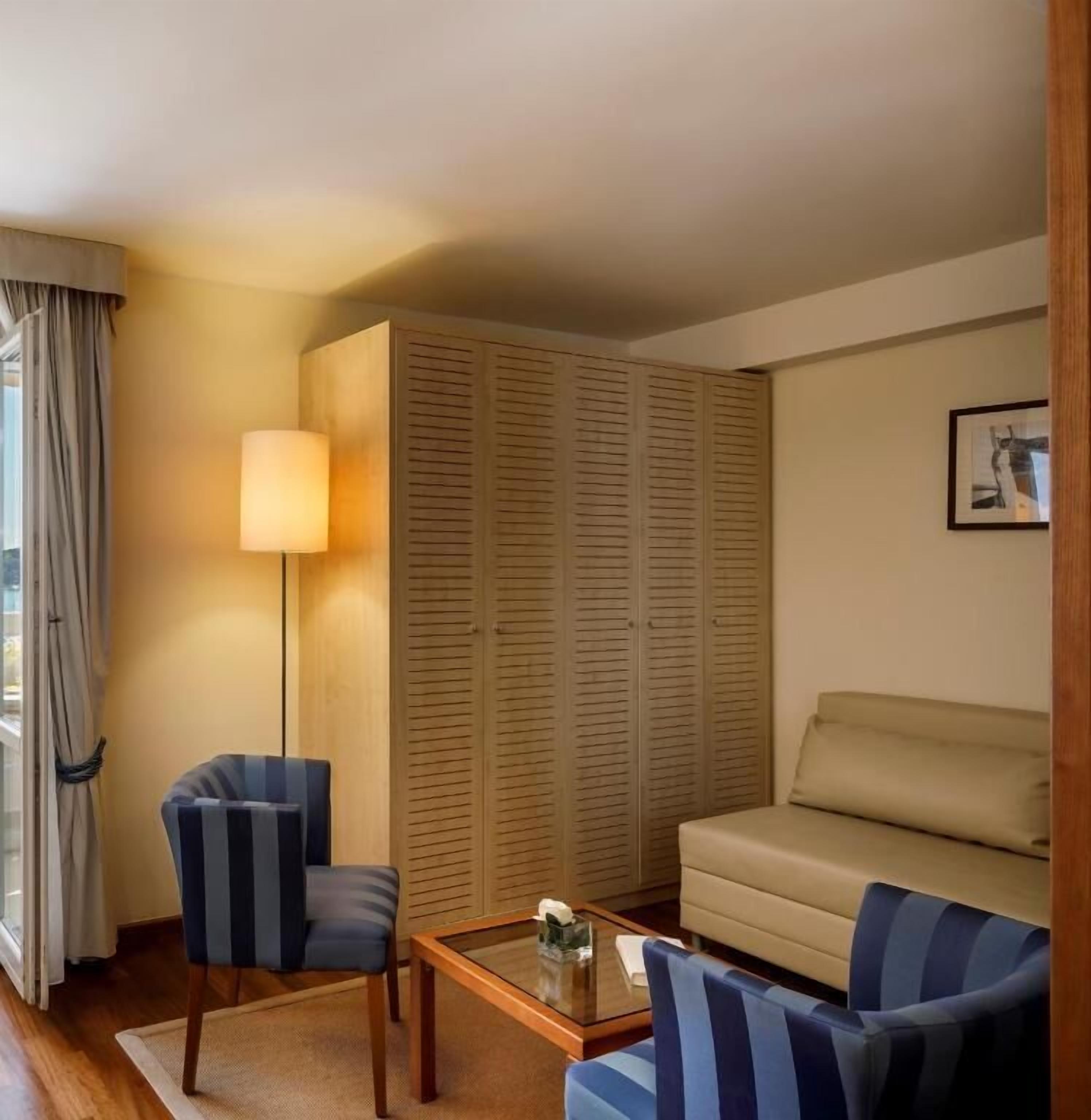 one bedroom suite | living area | 1-inch lcd tv with satellite channels, tv, pay films