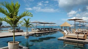 Outdoor pool, pool umbrellas, sun loungers