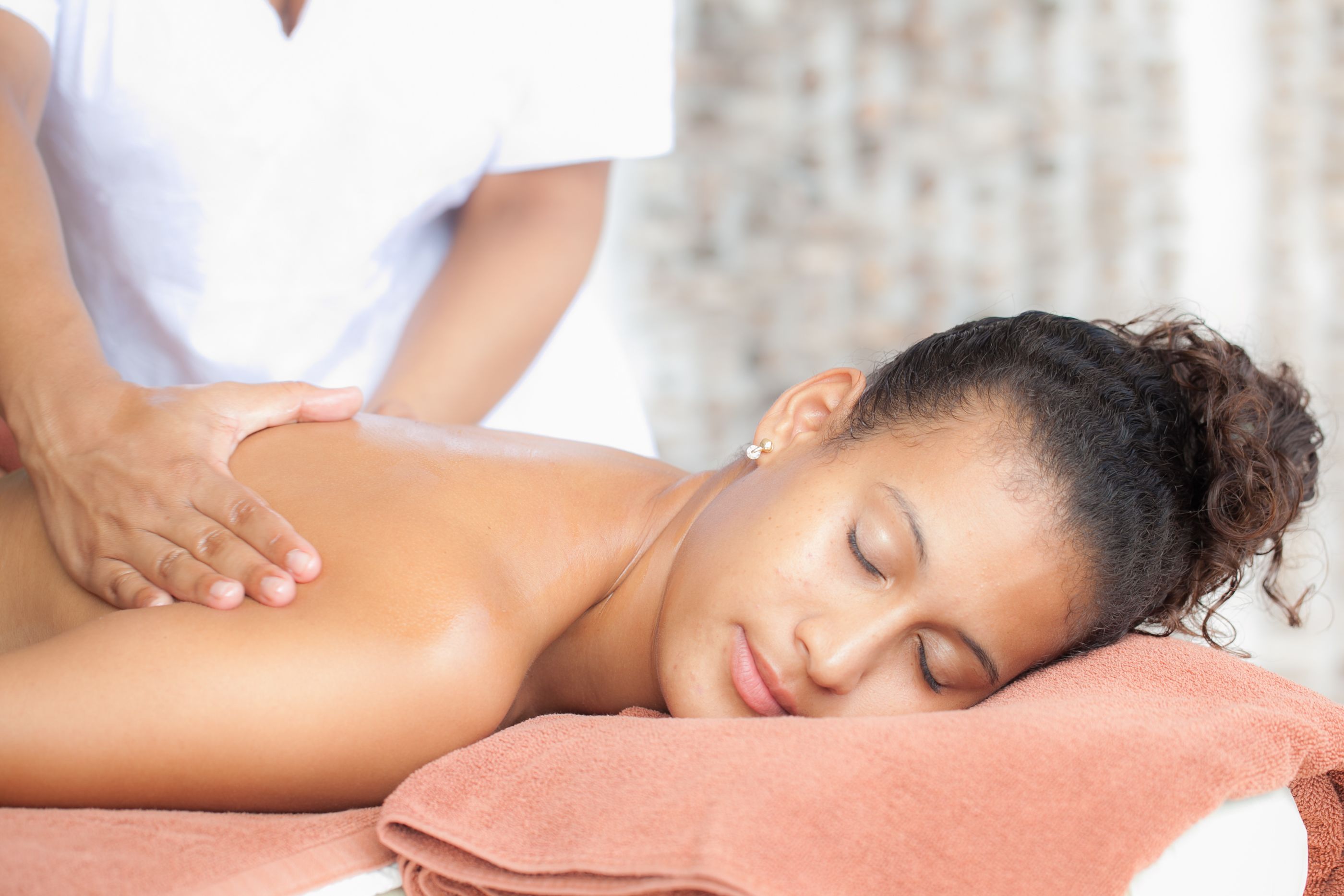 A person receiving a back massage.