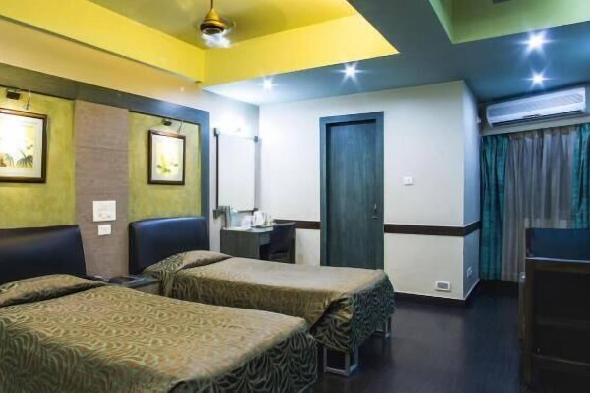 Premium Double or Twin Room | Minibar, desk, iron/ironing board, rollaway beds