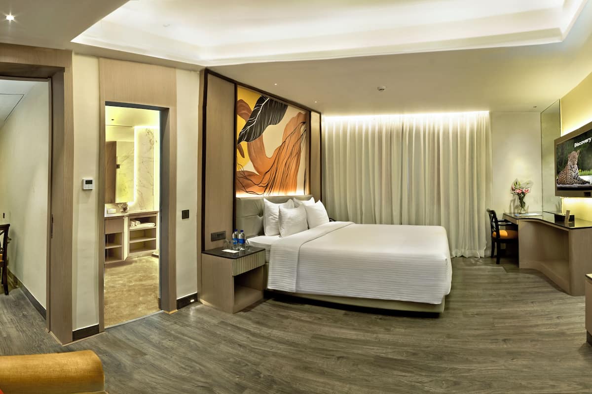Suite ejecutiva, 1 cama King size, vista a la ciudad | 1 habitación, ropa de cama de alta calidad y minibar