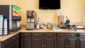 A kitchen area with a coffee machine, toaster, and microwave. - La Quinta Inn & Suites by Wyndham Moreno Valley (Moreno Valley)