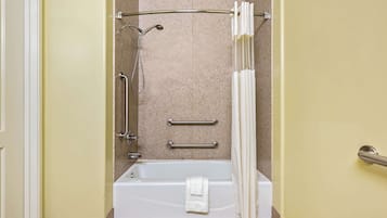 A bathroom with a bathtub, a shower, and a toilet.