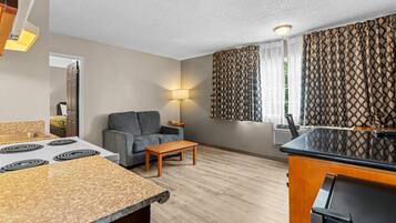 Suite, 1 King Bed with Sofa bed, Non Smoking (Efficiency) | Desk, blackout drapes, iron/ironing board, free WiFi