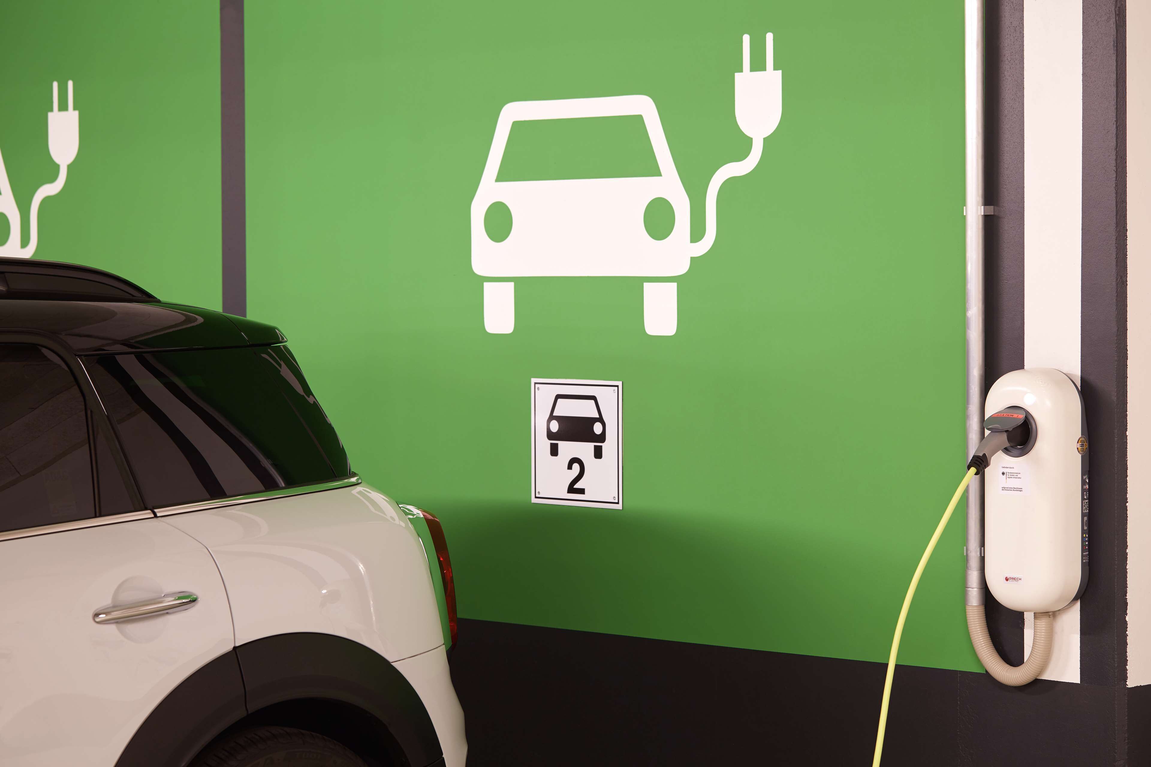 A parking space with a charging station for electric vehicles.