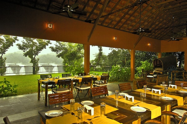 Breakfast, lunch, dinner served; local cuisine, al fresco dining 